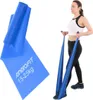 A woman is using a blue Pilates training band for exercise, with a close-up of the band showing branding and weight information. Náhled obrázku produktu