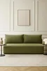 A modern living room with a green sofa and a framed artwork on the wall. Anteprima dell’immagine prodotto