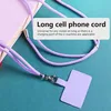 A close-up of a purple cell phone lanyard and attachment, with text overlay. Podgląd zdjęcia produktu