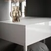 A close-up shot of a white vanity table with a gold vase containing dried flowers. Náhled obrázku produktu
