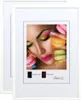 A collage of a woman's face with colorful makeup and macarons, presented within a white picture frame. Produktbild-Vorschau