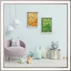 A child's room with a chair, toys, and artwork on the wall. Anteprima dell’immagine prodotto