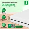 An image showcasing a mattress with various descriptive icons and text highlighting its features and quality. The background transitions from a light green to a light brown wooden floor. Produktbild-Vorschau