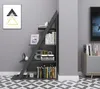 A modern, anthracite-colored bookshelf with a unique angled design, placed against a light gray wall. The bookshelf is decorated with books, picture frames, and decorative objects. Náhled obrázku produktu