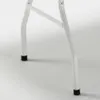Close-up of the white metal legs of a folding table with black caps on the feet. Produktbild-Vorschau