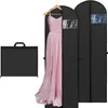 A collection of garment bags, with one open to reveal a pink dress. Produktbild-Vorschau