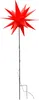 A red star-shaped garden stake with a light. Produktbild-Vorschau