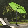 An outdoor scene with a green umbrella and two lounge chairs. Voir les images du produit