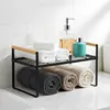 A bathroom shelf organizer with towels and dispensers. Anteprima dell’immagine prodotto