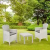 A white garden set with a table and two chairs is placed on a green lawn in a garden setting. Produktbild-Vorschau