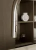 A close-up shot of a kitchen faucet with a shelf in the background. Produktbild-Vorschau