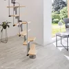 A spiral staircase with wooden steps and metal railings is shown in a room with light-colored flooring and a large window overlooking a garden. Produktbild-Vorschau