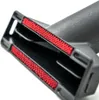 A close-up view of a vacuum cleaner attachment with red bristles. Produktbild-Vorschau