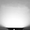 A black LED spotlight is shown from the front, illuminating a textured white surface above it. Produktbild-Vorschau