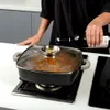 A person is pouring wine into a pot on a stove. Náhled obrázku produktu