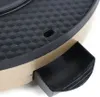 Close-up of a black textured surface with a gold rim and a black pull-out drawer. Voir les images du produit