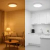 A split image showing a living room on the left and a kitchen on the right, both featuring ceiling lights. Náhľad obrázku produktu