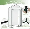 A white greenhouse with green trim and frame, shown with close-up details of its construction. Produktbild-Vorschau