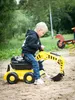 A young boy is playing with a toy excavator in the sand. Podgląd zdjęcia produktu