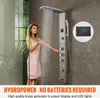 A woman is using a modern shower panel system in a bathroom. Anteprima dell’immagine prodotto