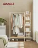 A bedroom scene with a clothes rack and shelves, featuring clothing, bags, and shoes. Náhled obrázku produktu