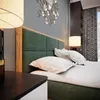 A close-up view of a bed in a bedroom setting, focusing on the headboard and bedding. Podgląd zdjęcia produktu