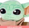 Close-up of a plush toy's face, showing its embroidered eyes and ears. Produktbild-Vorschau