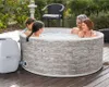 A family enjoying a hot tub in a backyard setting. Produktbild-Vorschau