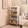 A white plastic storage cabinet with multiple shelves filled with books and decorative items, placed next to a sofa in a room. Anteprima dell’immagine prodotto