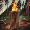 A large wooden log burning with a bright flame in a forest setting. Produktbild-Vorschau