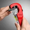 Hands using a red pipe cutter on a metal pipe. Produktbild-Vorschau