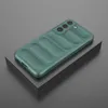 A green phone case with a ribbed texture is displayed on a gray surface. Produktbild-Vorschau