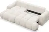 A cream-colored sectional sofa with a tufted design, shown with a portion extended, revealing a storage compartment. Produktbild-Vorschau