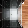 A top-down view of a modern shower enclosure with black tiled walls and a wooden floor. Produktbild-Vorschau