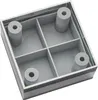 A square, gray plastic furniture foot with four cylindrical supports inside, viewed from a top-down angle. Produktbild-Vorschau