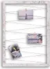 A rustic white wooden frame with strings and clothespins holding up three small photographs. Produktbild-Vorschau