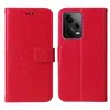 A red flip phone case with a floral and butterfly design is shown open and closed. Produktbild-Vorschau