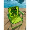 A child's chair with a frog design sits on a patio next to a swimming pool. Produktbild-Vorschau