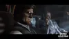 Two men in suits are sitting in a dimly lit room, possibly an office. Produktbild-Vorschau