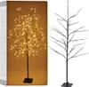 A product image showing a decorative LED tree with lights on the left and the bare tree structure on the right, presented against a brown background. Podgląd zdjęcia produktu