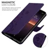 A purple flip case for a smartphone, with floral patterns and text describing its features. Náhled obrázku produktu