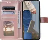 A pink flip case for a Samsung Galaxy A14 4G/5G phone is shown open, displaying card slots and a photo window. A person is holding a gray phone case in the phone's screen area. Produktbild-Vorschau