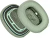 Two green ear pads for headphones are shown against a white background. Podgląd zdjęcia produktu