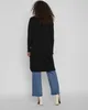 A woman is shown from the back wearing a long black cardigan and blue jeans. Produktbild-Vorschau