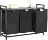 A laundry sorter with a wooden top shelf and three black fabric bins, set against a white background. Podgląd zdjęcia produktu