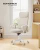 A beige office chair is shown in a room with a window and bookshelves. Produktbild-Vorschau