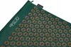 A green acupressure mat with gold-colored spikes is shown diagonally against a white background. Náhľad obrázku produktu