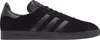 A side view of a black Adidas Gazelle sneaker. Voir les images du produit