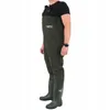 A person wearing dark green waders and boots. Produktbild-Vorschau