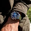 A close-up shot of a person's wrist wearing a Tissot watch. Produktbild-Vorschau
